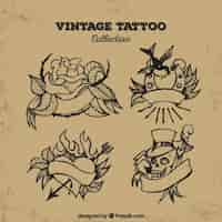 Vetor grátis jogo de quatro tatuagens mão tirada vintage