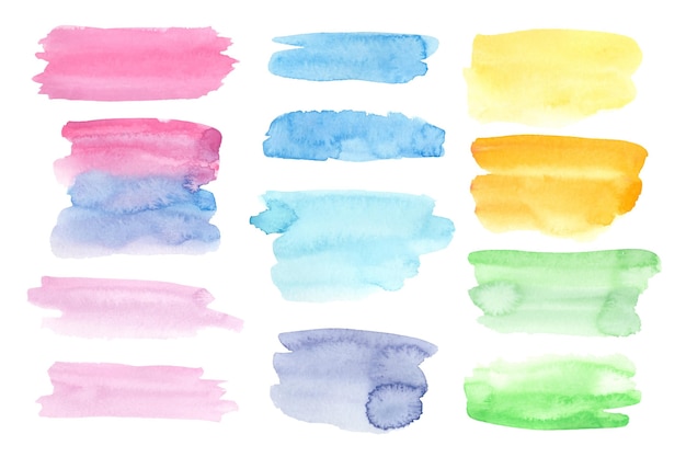 Vetor grátis manchas de aquarela pintadas à mão