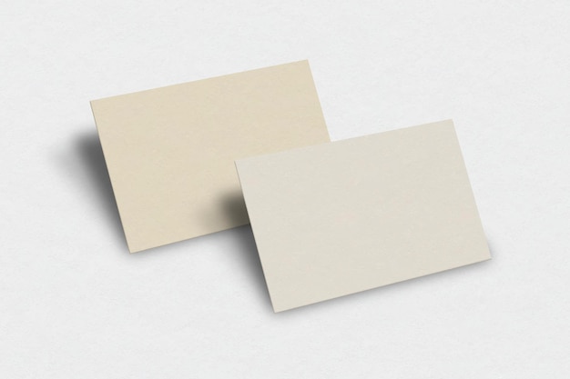 Maquete de cartão de visita em branco em tom dourado claro com vista frontal e traseira