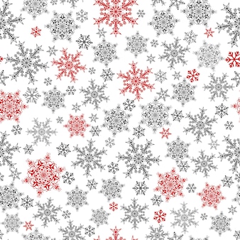 Padrão sem emenda de natal de flocos de neve grandes e pequenos, vermelho e cinza em branco