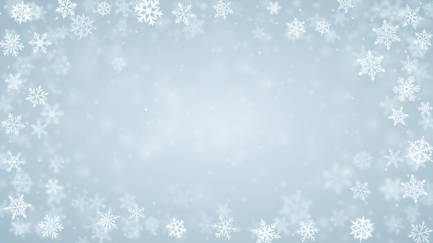 Plano de fundo de natal de complexos flocos de neve caindo nítidos e desfocados em cores azuis claras com efeito bokeh