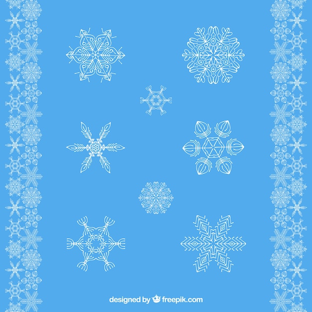 Seleção de flocos de neve decorativos com fundo azul