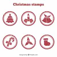 Vetor grátis selos vermelhos de natal redondos