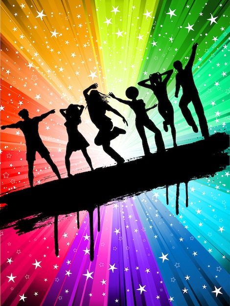 Silhuetas de pessoas dançando em um fundo multi colorido estrelado