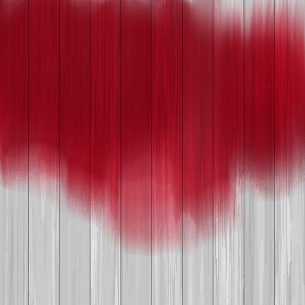 Vetor grátis splatter de tinta vermelha sobre uma textura de madeira
