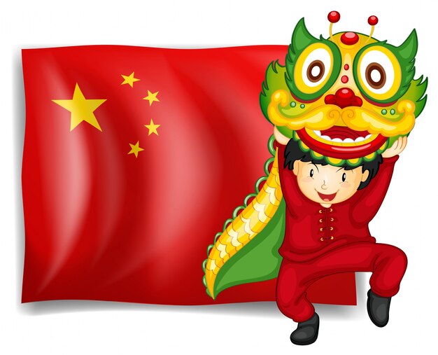 Um menino que faz a dança do dragão na frente da bandeira da China