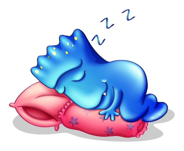 Um monstro azul dormindo acima de um travesseiro