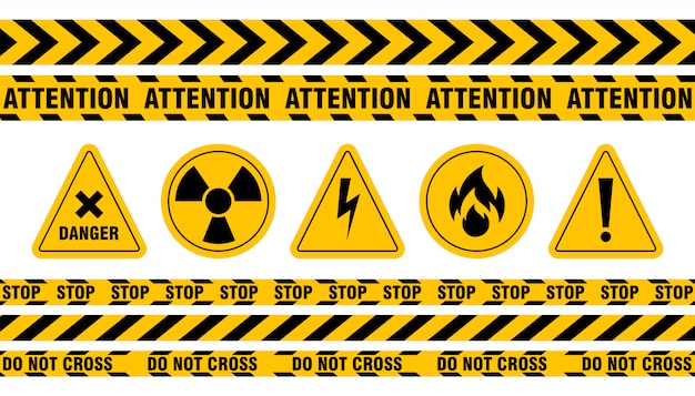 Vários conjuntos de fitas e sinais de perigo