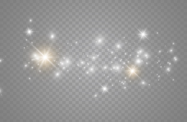 A poeira faisca e as estrelas douradas brilham com luz especial. brilha em um fundo transparente. Partículas de poeira mágica cintilante.