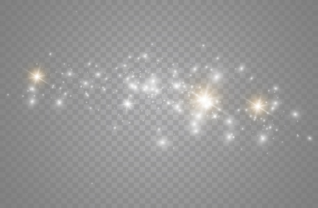 As faíscas de poeira e estrelas douradas brilham com uma luz especial. brilha em um fundo transparente. Partículas de poeira mágica cintilantes.