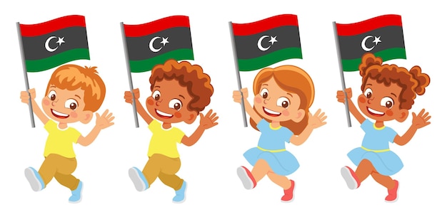 Bandeira da líbia na mão. crianças segurando uma bandeira. bandeira nacional da libia