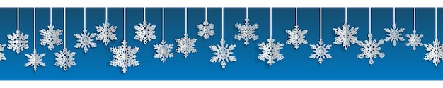 Banner sem costura de natal com flocos de neve de papel de volume com sombras suaves sobre fundo azul com repetição horizontal