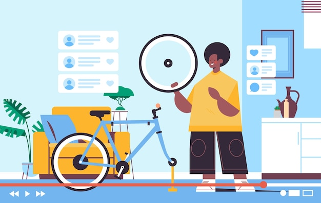 blogueiro masculino consertando bicicleta gravação de vídeo blog online streaming ao vivo conceito de blogging homem verificando defeitos em pneus oficina interior horizontal
