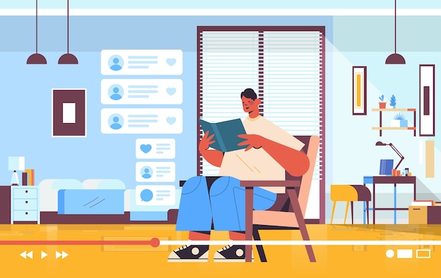 blogueiro masculino lendo livro gravação de blog de vídeo online streaming ao vivo conceito de blog na sala de estar interior horizontal