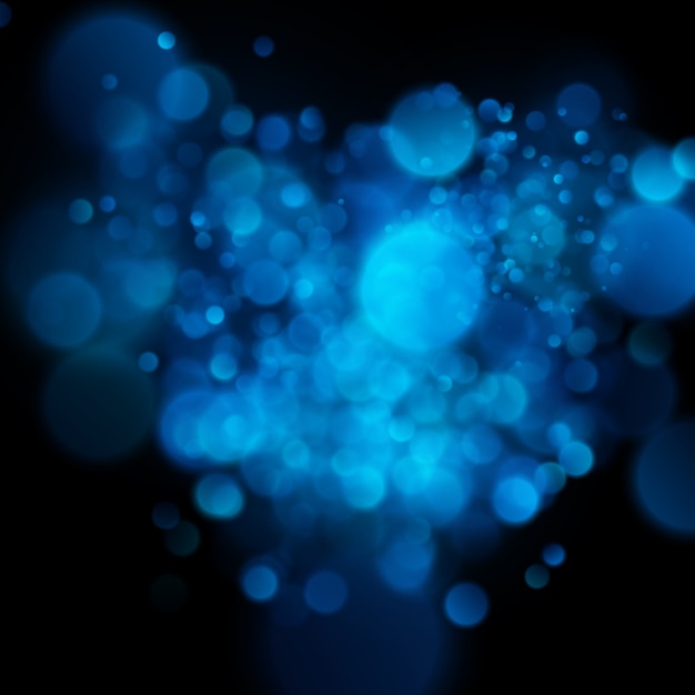 Bokeh azul circular defocused abstrato no fundo escuro.