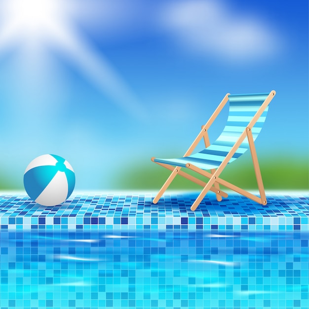 Bola e cadeira à beira da piscina
