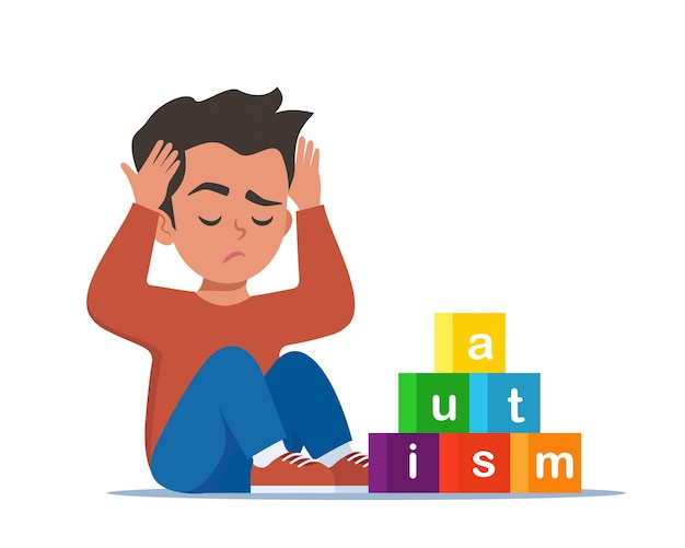 Conceito de autismo menino se sentindo sozinho menino triste sentado no chão cercado por cubos de brinquedos