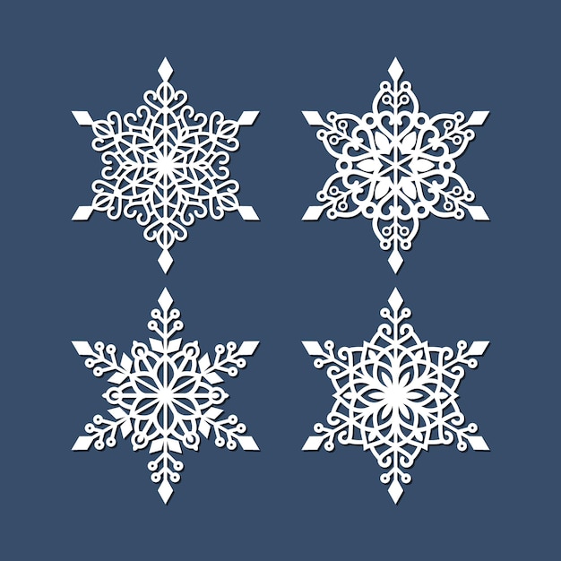 conjunto de flocos de neve de corte a laser isolados em azul