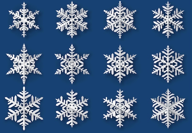 Conjunto de lindos flocos de neve de natal de papel complexo com sombras suaves, branco sobre fundo azul