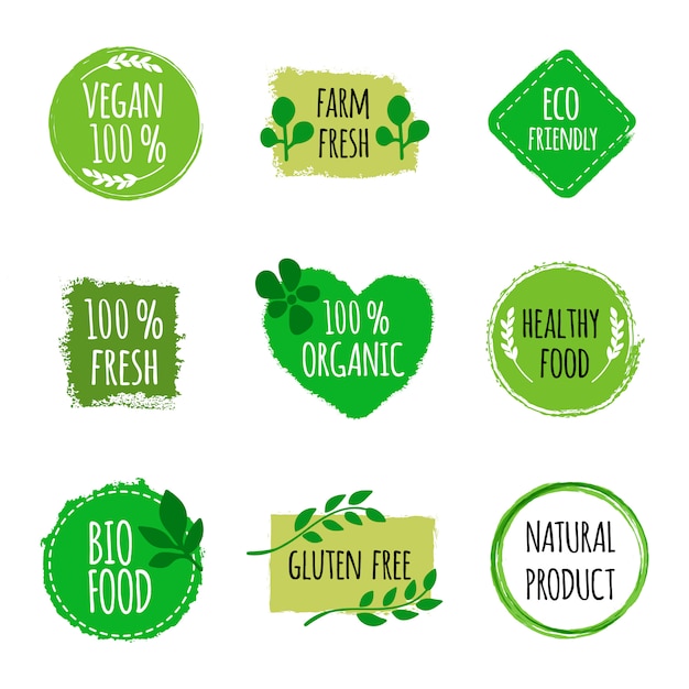 Conjunto de logotipos vegan, emblemas, sinais. mão desenhada bio, emblemas de comida saudável. logotipo vegano.