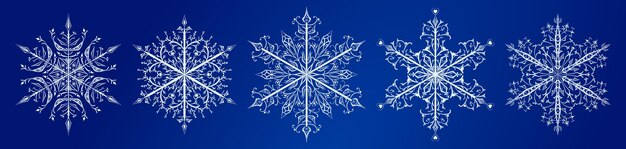 Conjunto de vários lindos e complexos flocos de neve de natal brancos sobre fundo azul