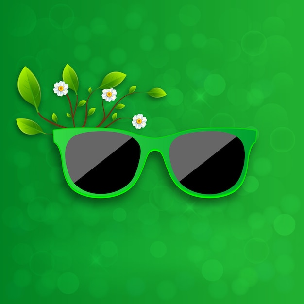 Óculos de sol em fundo verde.