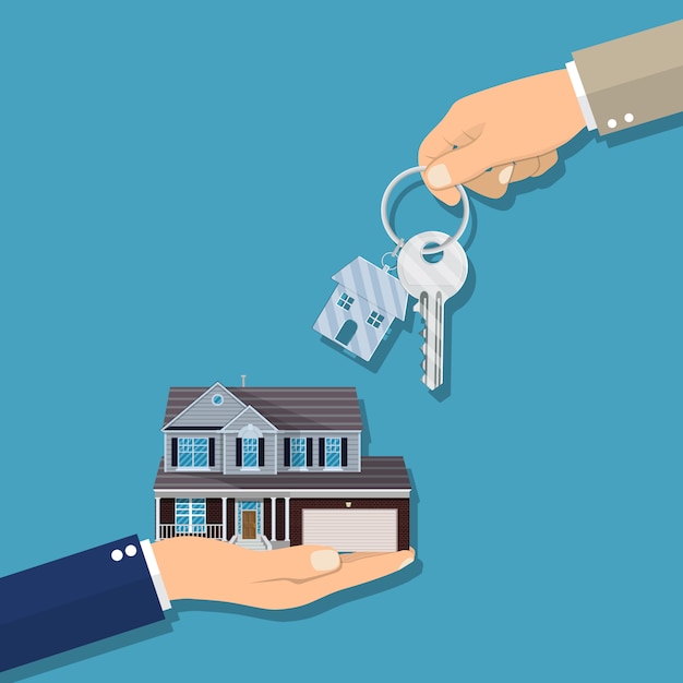 Empresário mãos dando chave para casa