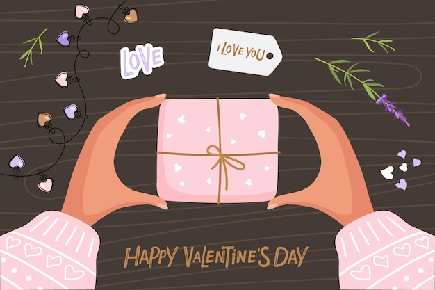 Feliz dia dos namorados letras manuscritas mãos femininas segurando caixa de presente em embalagem rosa