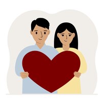 Feliz homem e mulher segurando um grande coração vermelho em suas mãos amor