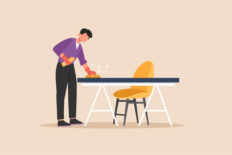 Garoto de escritório limpando a mesa no escritório Conceito de serviço de limpeza Ilustração vetorial gráfica plana colorida isolada