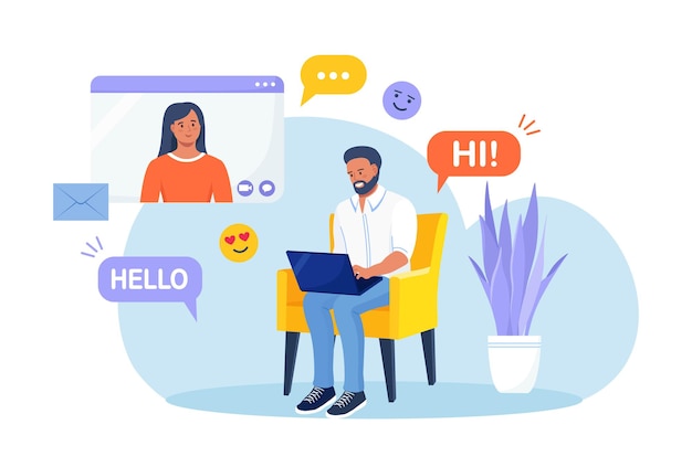 Homem está sentado na poltrona e usando o laptop para videochamada com namorada ou colega. Amigos conversando online. Educação online e e-learning. Mídia social ou aplicativo de namoro e relacionamento virtual
