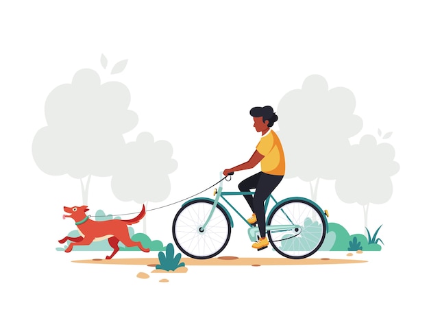 Homem negro andando de bicicleta com cachorro no parque.