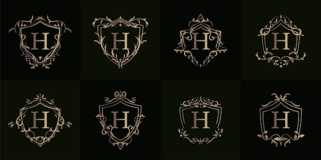 Inicial do logotipo h com ornamento de luxo ou moldura de flor