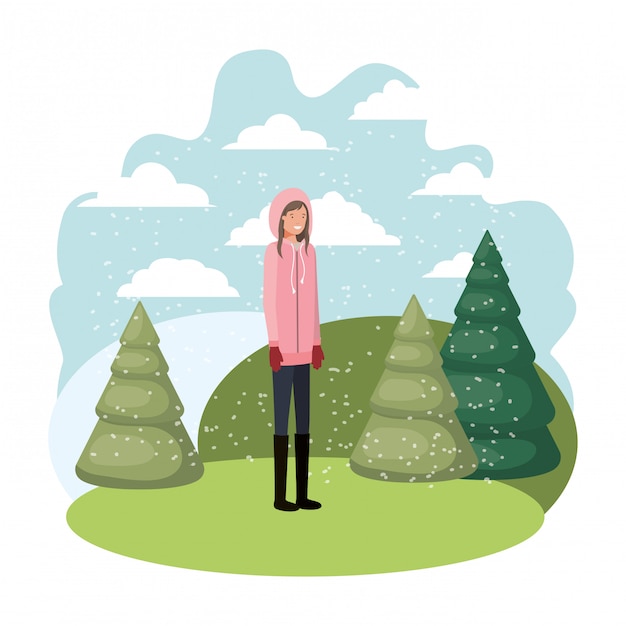 jovem mulher com roupas de inverno e pinheiros de inverno