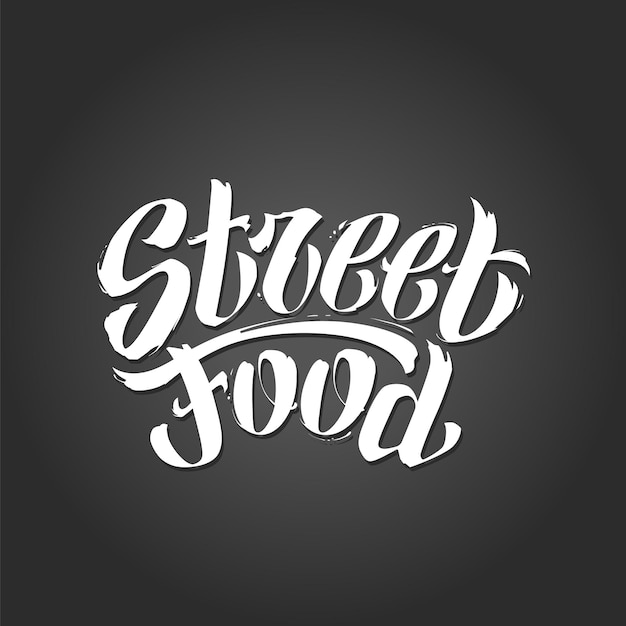 Vetor letras de vetor de comida de rua. graffiti manuscrito palavras 'streed food'. letras brancas à mão livre em fundo escuro. ilustração do vetor eps10.