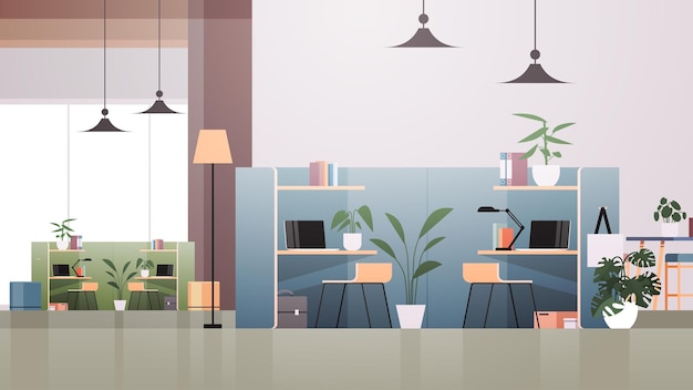 locais de trabalho com laptops em um centro de coworking vazio moderno sala de escritório espaço aberto