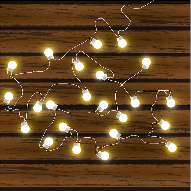 Vetor luzes de natal isoladas em fundo escuro de madeira glow garland vector brilham lâmpadas de natal em fios