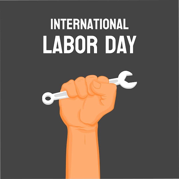 Mão agarrando uma chave inglesa Dia Internacional do Trabalho