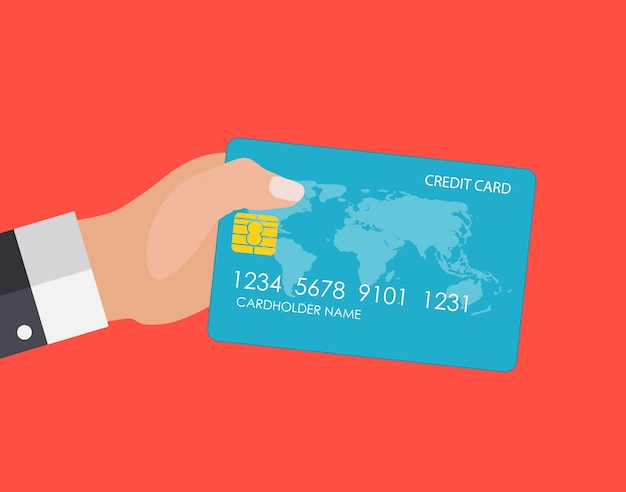 Mão segurando o cartão de crédito. Conceito de pagamentos financeiros e on-line