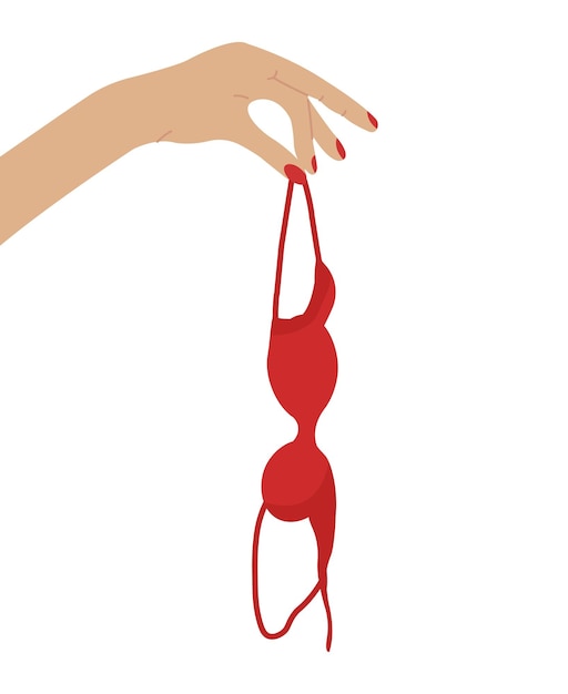 Mão segurando sutiã vermelho em conceito de conscientização da mama Sutiã pendurado isolado