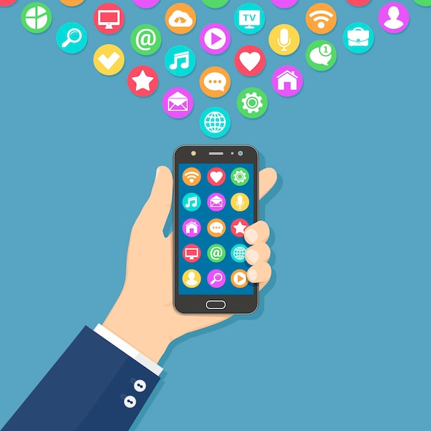 Mão segurando um smartphone com ícones de aplicativos coloridos na tela