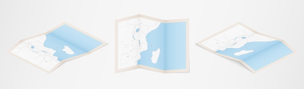 Mapa dobrado de Comores em três versões diferentes.