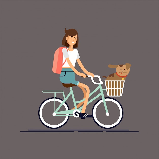 Menina anda de bicicleta com cachorro