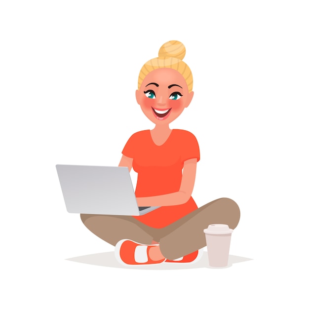 Menina está sentado e trabalhando atrás de um laptop. Trabalho remoto e comunicação em redes sociais