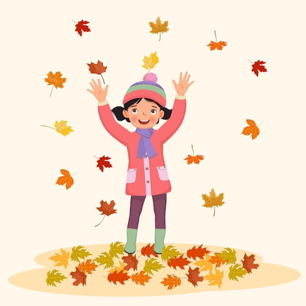 menina feliz brincando lá fora com folhas caídas no outono