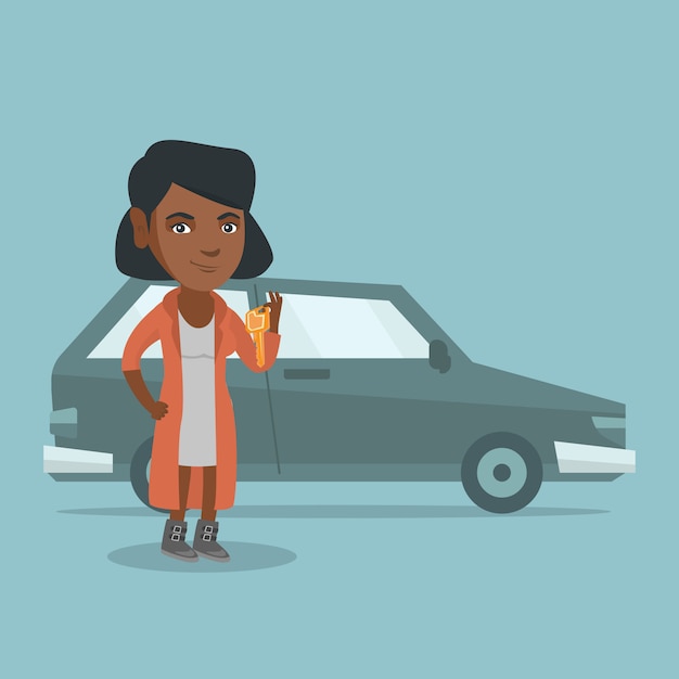 Mulher africana nova que guarda chaves a seu carro novo.