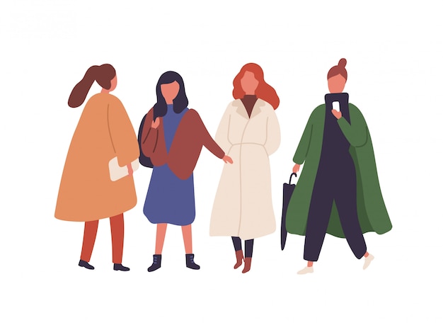 Vetor mulheres na ilustração plana de roupas de outono. meninas elegantes caminhando juntos isolado no branco. personagens femininas em casacos elegantes de outono. estudantes, modelos com roupas da moda.