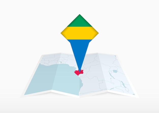 O gabão é representado em um mapa de papel dobrado e um marcador de localização fixado com a bandeira do gabão.