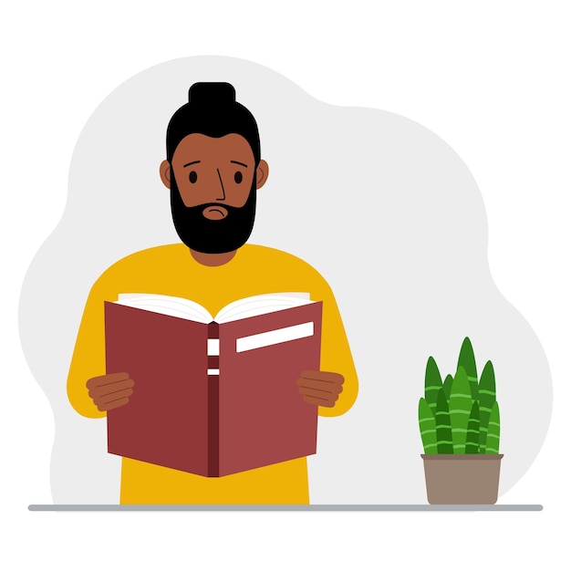 O homem está segurando um grande livro nas mãos