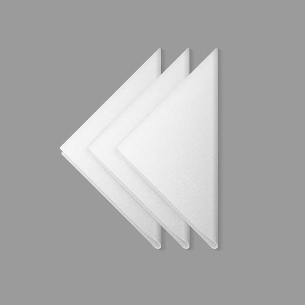 Opinião superior dobrada branco dos guardanapo trianglular no fundo. configuração da tabela